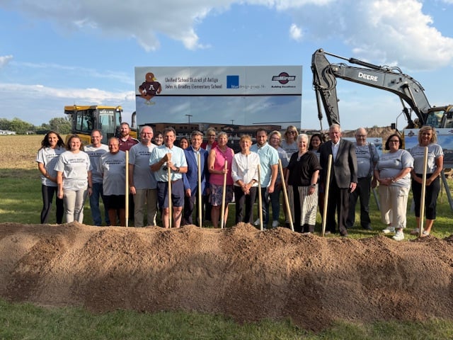 Photo of district leaders, board members, and community members at the groundbreaking ceremony for John H. Bradley Elementary School